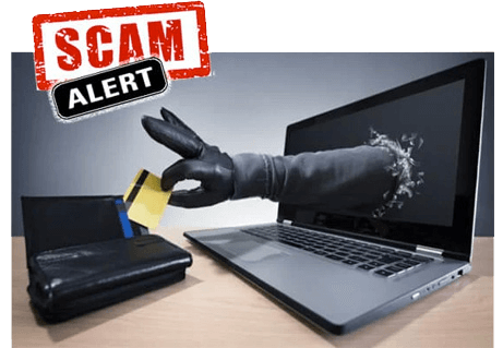 hand coming from laptop and stealing credit card - scam alert